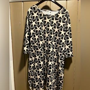 3/4 sleeve Black dress with starfish pattern. Mid length.